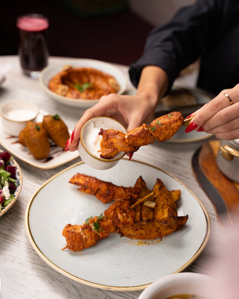 Tempting fried chicken with dipping sauce on a beautifully set table.