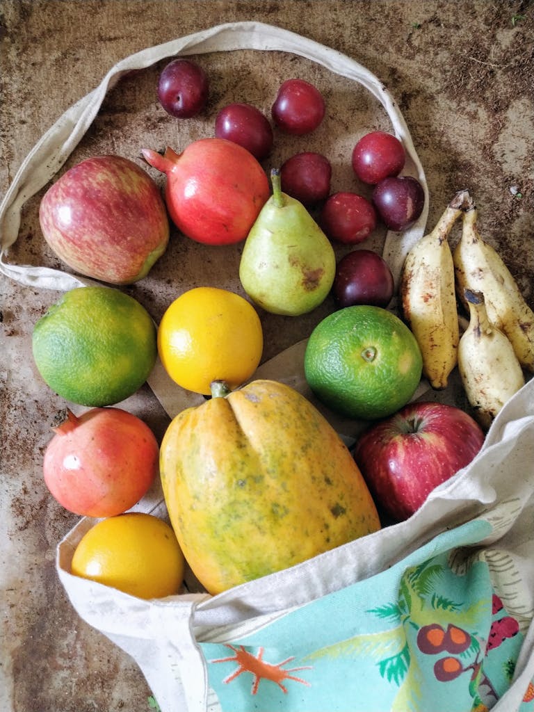 A colorful collection of tropical fruits in a bag, showcasing fresh and healthy eating.